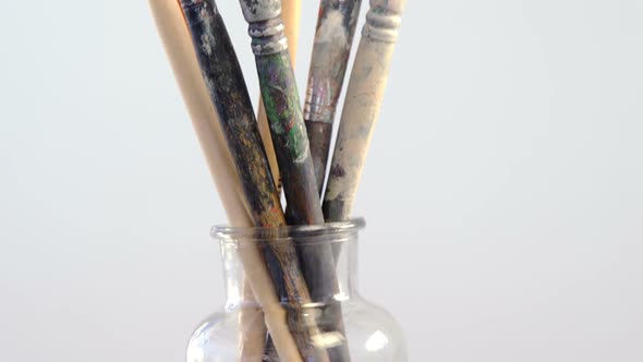 Various paintbrush in glass container