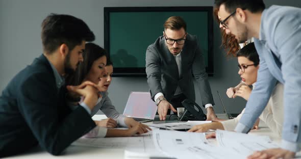 Group of Business People Collaborating in Business Office