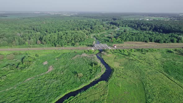 Railway Bridge in Countryside Passing Above Small River