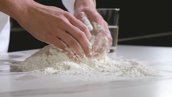 Kneading dough. Preparation of dough for baking bread and pizza.