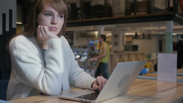 Thinking Brainstorming Young WomanWorking in Cafe