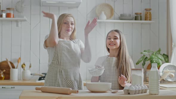 Caucasian Family Single Mother Mom with Child Teen Girl Daughter Having Fun in Home Kitchen Play