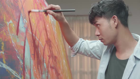 Man Artist Works On Abstract Oil Painting