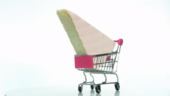 A Natural Slice Of Cheese In A Supermarket Trolley Is Spinning On A Turntable,Appetizing Hard Cheese