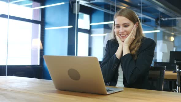 Excited Woman Celebrating Success, Working on Laptop