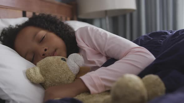 African american girl sleeping in her bed