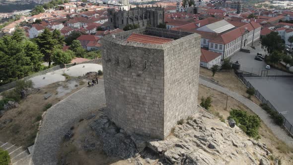 Aerial footage of guarda old medieval city with stone fortifications and Christian Cathedral