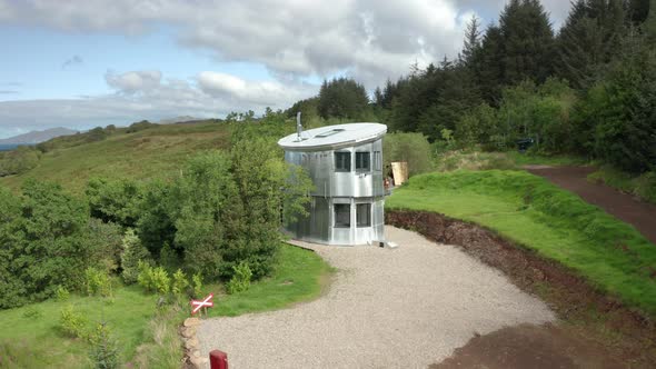 AERIAL REVEAL - Rotating shot revealing the sea behind the quirky modern home