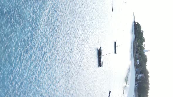 Tanzania Vertical Video  Boat Boats in the Ocean Near the Coast of Zanzibar Aerial View