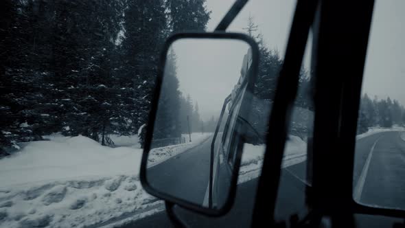 Drivers View in the Rearview Mirror Reflection