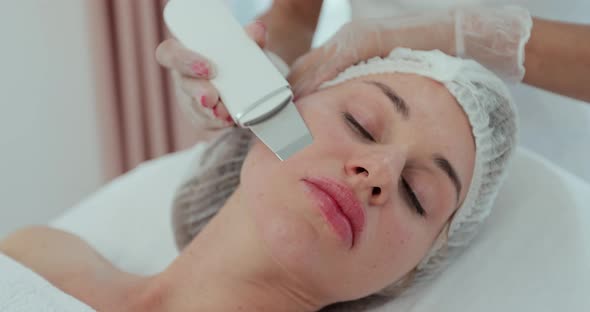 Closeup of Beautiful Woman Receiving Ultrasound Cavitation Facial Peeling