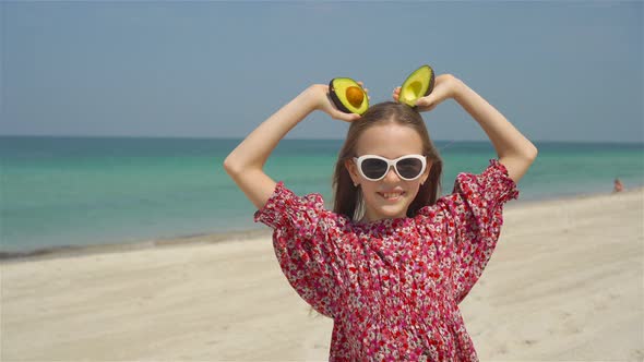 Cute Little Girl at Beach During Summer Vacation