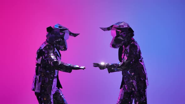 Mirrored Cyber People in Costumes of Horned Bulls Having Fun Toss Their Hands on Neon Blue Pink