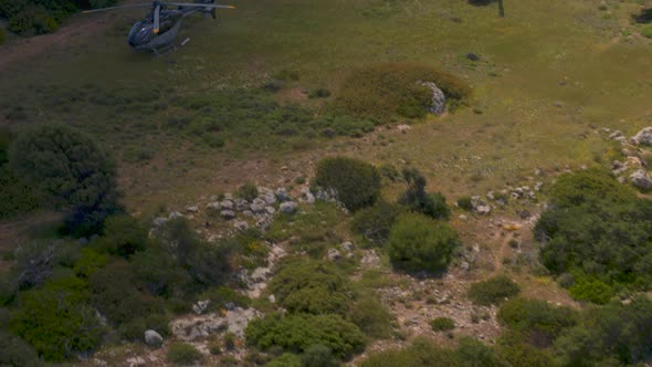 Aerial Pan Around of Private Helicopters Parked on a Hill Near Loutraki Greece