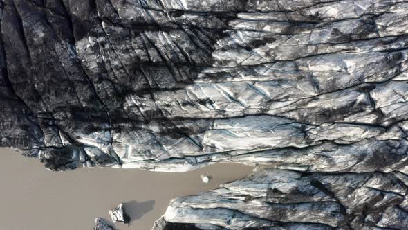 Top Down View Of Solheimajokull Glacier In Iceland - aerial drone shot