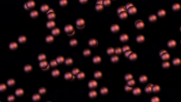 Chaotic Brownian motion of copper balls on a black background.