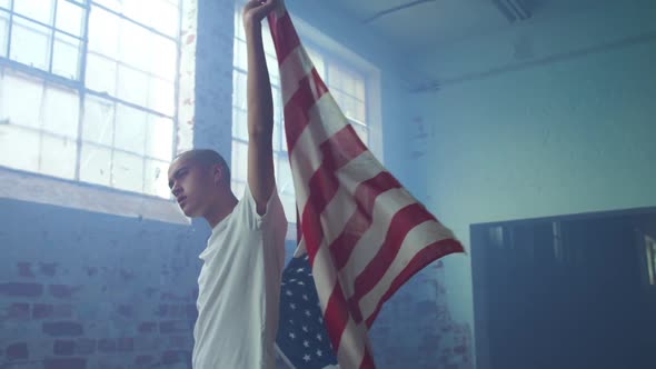 Fashionable young man in an abandoned warehouse