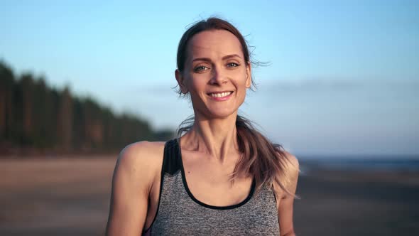 Portrait Happy Blonde Fitness Woman Running Jogging Outdoor Sunset Beach Training Healthy Lifestyle