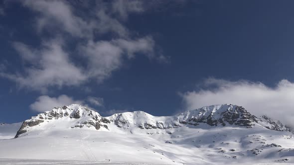 High Altitude Rocky Snowy Mountain Ridge in Treeless Terrestrial Winter Climate