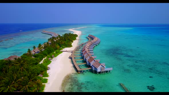 Aerial drone seascape of tranquil lagoon beach lifestyle by blue water with white sand background of