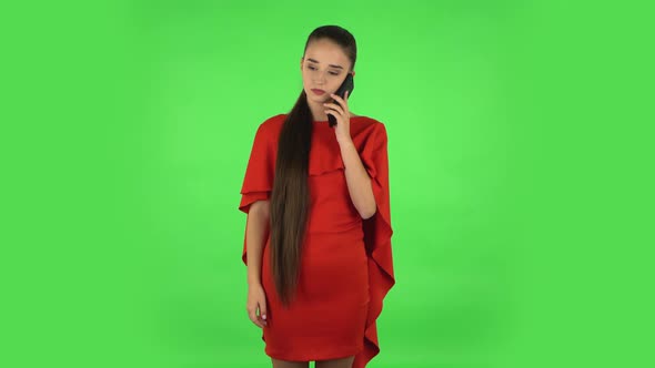 Pretty Young Woman Is Talking for Mobile Phone. Green Screen