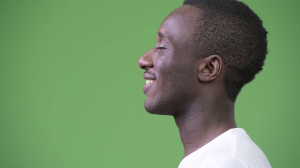 Profile View of Young Happy African Man Relaxing with Eyes Closed