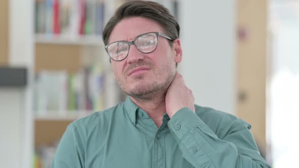 Middle Aged Man Having Neck Pain Injury