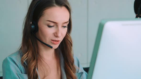 Business People Wearing Headset Working in Office