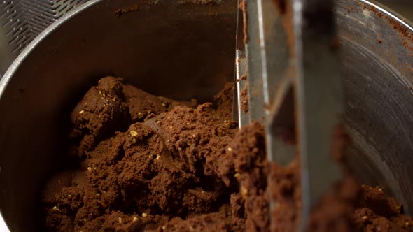 Tank Filled with Brown Dough.