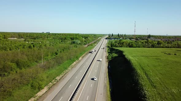 Aerial View of Cars and Truck Drive Along the Highway