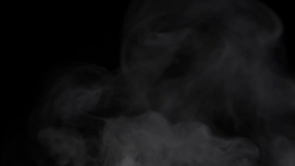 White Steam Smoke Flying Up Over Black Background