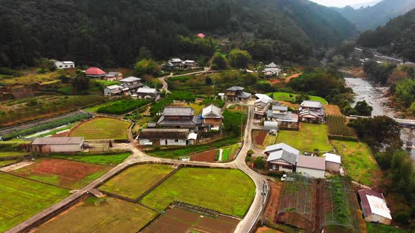 small village in japan alongside a beautiful river