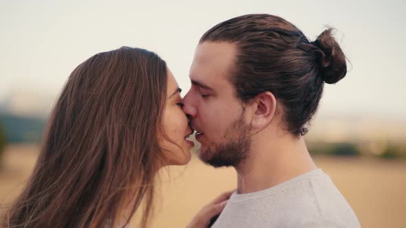 A Couple Deeply In Love Sharing A Romantic Kiss - Portrait Of A Young Couple Passionately Kissing