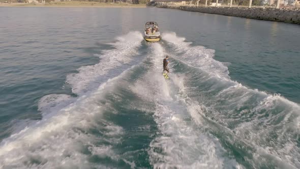 Aerial view of man doing water skiing in the mediterranean sea, Beirut, Lebanon.