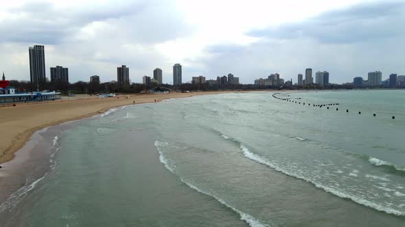 waves rolling in lake michigan chicago downtown area aerial footage