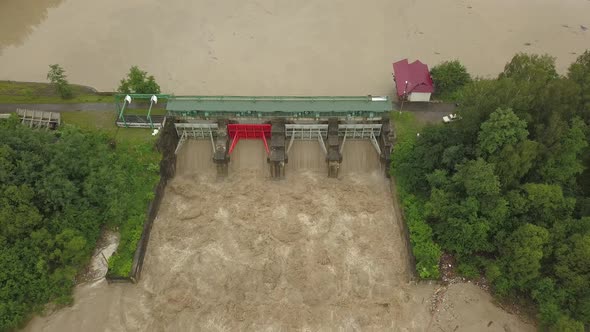 Aerial View of the Dam During Floods. Extremely High Water Level in the River.