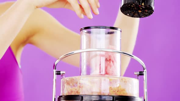 Woman preparing smoothie