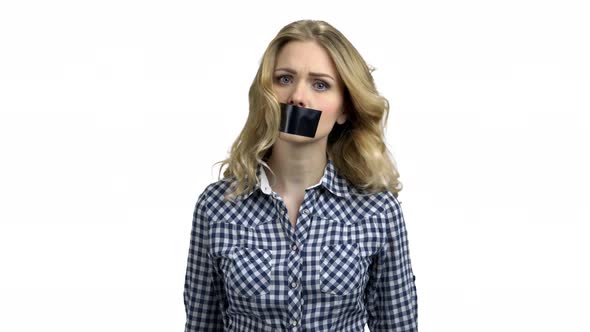 Caucasian Woman Protester with Tape on Mouth