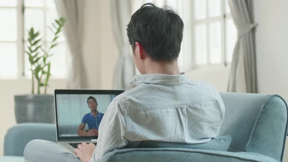 Man Video Conference Call From Laptop At Living Room