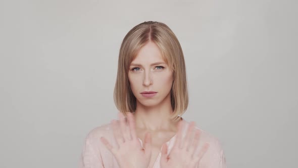 Studio portrait of young, beautiful and natural blond woman.