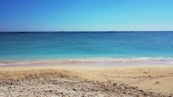 Aerial drone view landscape of marine shore beach vacation by blue sea and white sandy background of