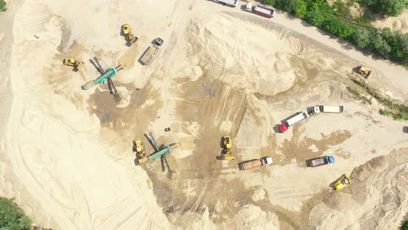 Mining conveyor at sand quarry. Aerial view of mining machinery. Mining industry