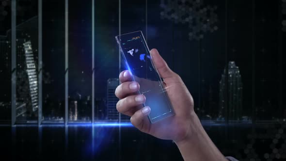 Hand holding futuristic mobile phone against digitally generated background