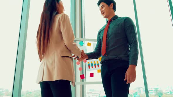 Business People Handshake in Corporate Office