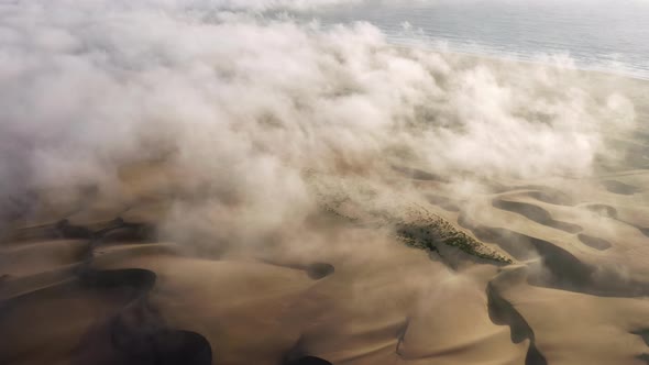 Drone Footage of the Sets of Sandy Hills Running Parallel to the Shoreline