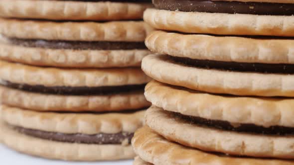 Round sandwich cookies filled  with chocolate close-up  slow tilt 4K 2160p 30fps UltraHD footage - S