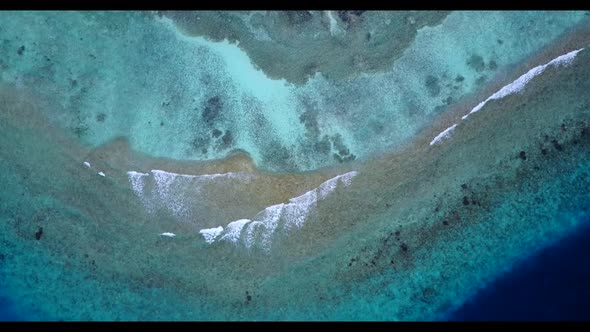 Aerial flying over nature of idyllic sea view beach wildlife by blue ocean and white sand background