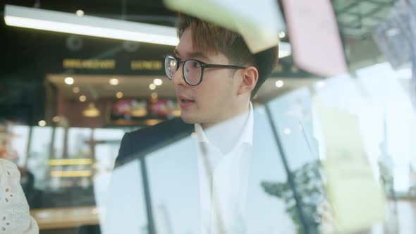 Smart attractive positive asian business male wearing glasses work remote