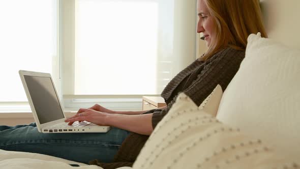 Woman working from home using laptop