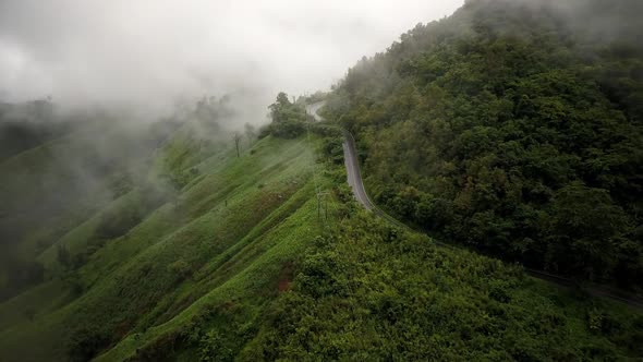 Countryside Road Passing Through The Mountain Landscape 